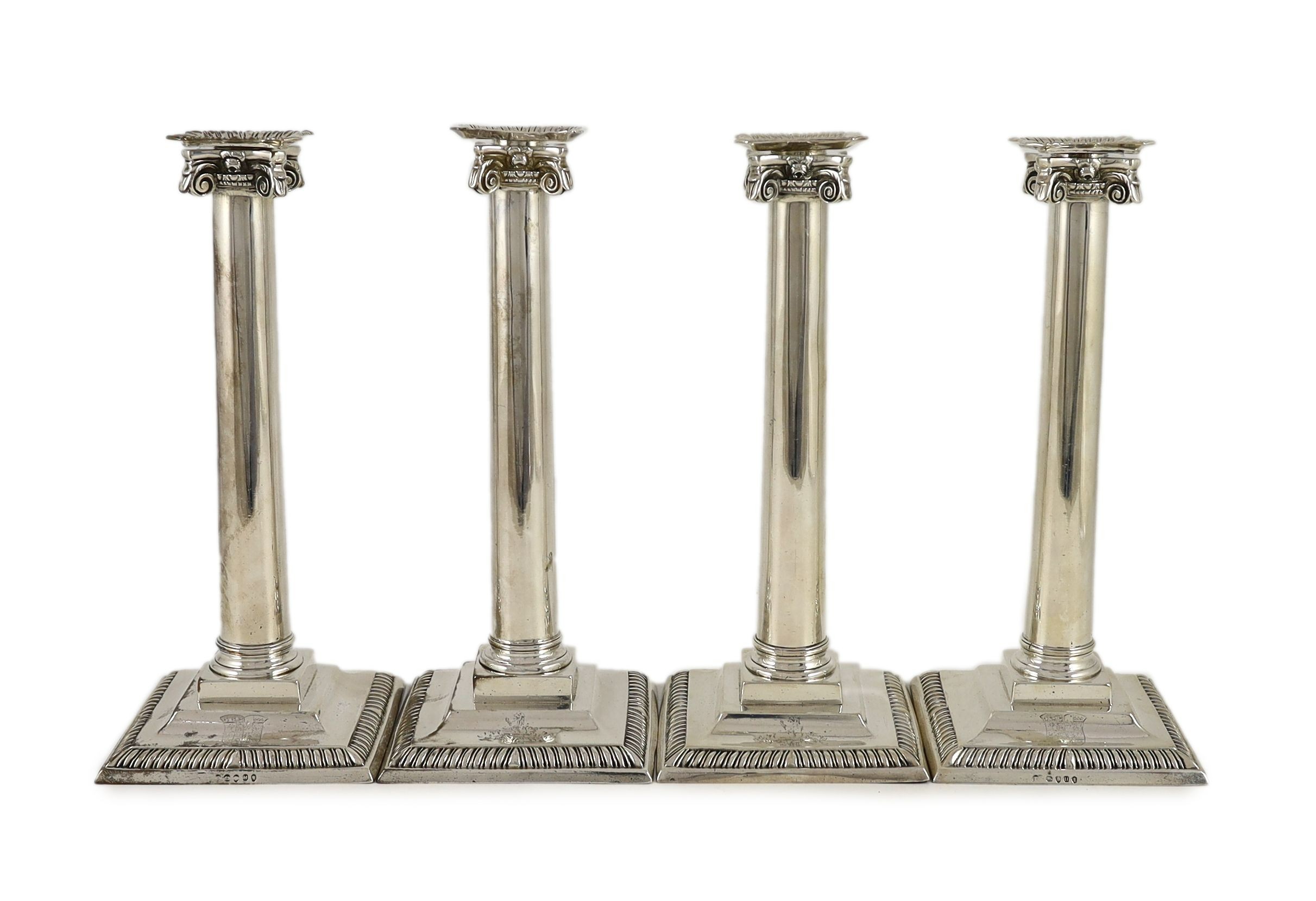 A set of three George III Corinthian silver ionic column candlesticks, by Thomas Shephard? London, 1795 and one other matched candlestick, Smith & Sharp, London, 1786